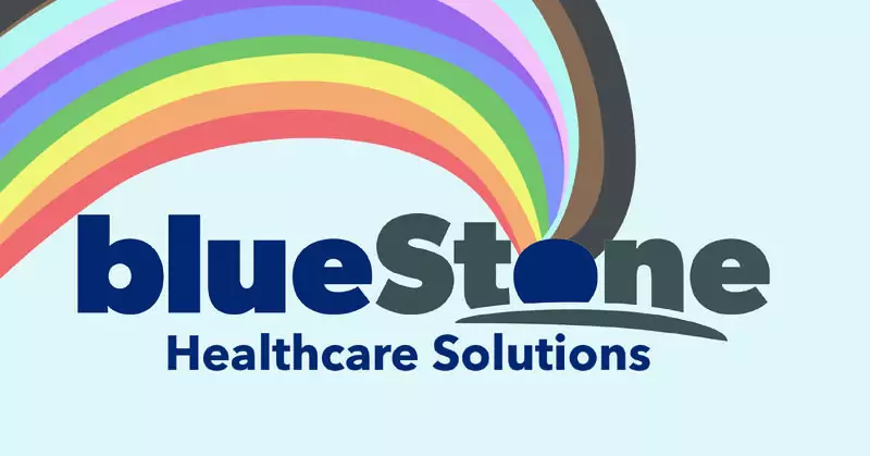 "Happy Pride Month" graphic featuring a rainbow flowing out of the first 'o' in the blueStone Healthcare Solutions logo